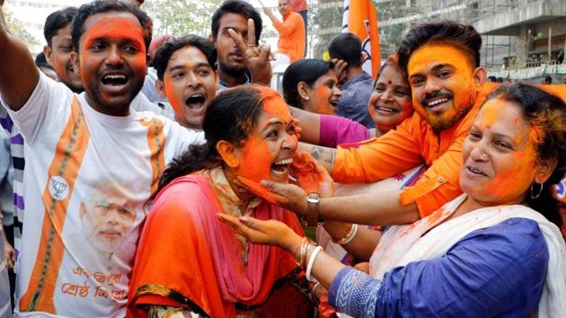 Bharatiya Janata Party supporters celebrate after the party’s win in Tripura assembly elections, in Agartala, on March 3.(Reuters File Photo)