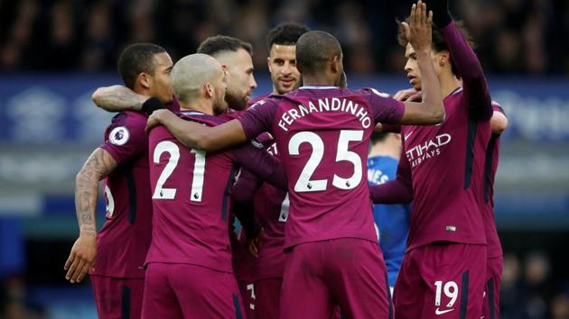 Manchester City warmed up for a season-defining month with a commanding 3-1 win over Everton at Goodison Park to set up a potential Premier League title party against rivals Manchester United.(REUTERS)