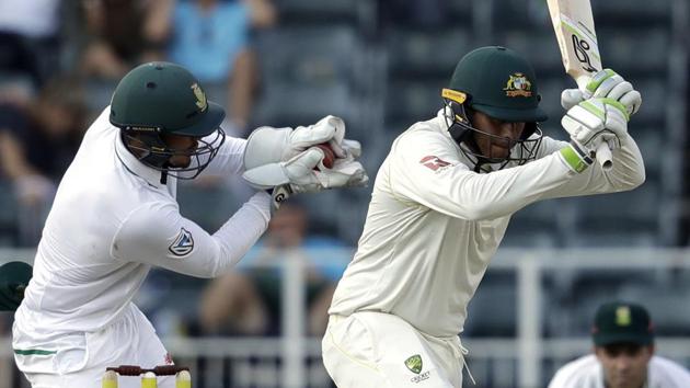 Quinton de Kock missed a stumping as he attended to his upper left arm to flick a bee away during the Johannesburg Test against South Africa. (AP) Quinton de Kock missed a stumping as he attended to his upper left arm to flick a bee away during the Johannesburg Test against South Africa. (AP)