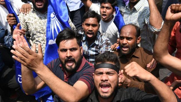 In Delhi, protesters blocked Janpath intersection near Connaught Place. Protesters also blocked road outside the Mandi House Metro Station, bringing traffic to a halt. “We have filed the review petition in Supreme Court. I appeal to all political parties & groups to maintain peace and not incite violence”, Union home minister Rajnath Singh told ANI news. (ARvind Yadav / HT Photo)