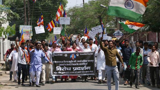 Dalit groups protest the alleged dilution of the SCs/STs Act in Sector 19, Noida, Uttar Pradesh. The Centre has rushed 800 anti-riot policemen to Uttar Pradesh and Madhya Pradesh with the closely monitoring the situation and is in constant touch with states to take preventive steps and maintain public order. (Virendra Singh Gosain / HT Photo)
