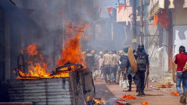 Police personnel patrol after a clashes and incidents of arson over Ram Navami procession at Raniganj in Burdwan district on March 26.(PTI File)