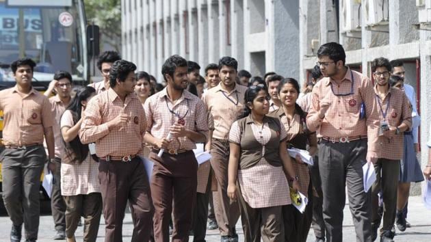 Students of Class 12 coming out after writing CBSE board examinations in Noida on March 26.(Sunil Ghosh / HT file)