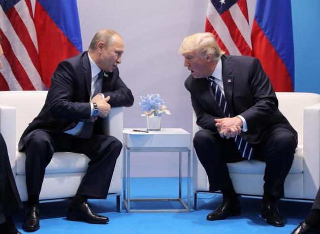 US President Donald Trump speaks with Russian President Vladimir Putin during the their bilateral meeting at the G20 summit in Hamburg, Germany July 7, 2017.(Reuters File Photo)