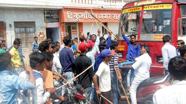 Dalit protesters stop an inter-state bus on the National Highway-58 in Haridwar on Monday.(RAMESHWAR GAUR/HT PHOTO) Dalit protesters stop an inter-state bus on the National Highway-58 in Haridwar on Monday.(RAMESHWAR GAUR/HT PHOTO)