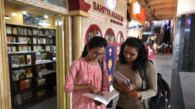 The stations have also become literary hubs. One of many opened in 2016, the Sahitya Akademi Metro Bookshop at Kashmere Gate has black and white pictures of Indian literary greats such as Toru Dutt, Devaki Nandan Khatri and Nagarjun. The teakwood shelves are stacked with titles in over two dozen Indian languages, and the interiors illuminated by soft, low-hanging lights. The bookshop also has a club for Metro commuters. (Raj K Raj / HT Photo) The stations have also become literary hubs. One of many opened in 2016, the Sahitya Akademi Metro Bookshop at Kashmere Gate has black and white pictures of Indian literary greats such as Toru Dutt, Devaki Nandan Khatri and Nagarjun. The teakwood shelves are stacked with titles in over two dozen Indian languages, and the interiors illuminated by soft, low-hanging lights. The bookshop also has a club for Metro commuters. (Raj K Raj / HT Photo)