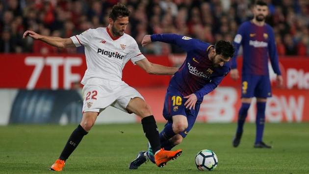 Barcelona were rescued by a late strike from Lionel Messi as they escaped with a 2-2 draw but Atletico Madrid cut their lead down to nine points with a 1-0 win over Deportivo La Coruna.(REUTERS)