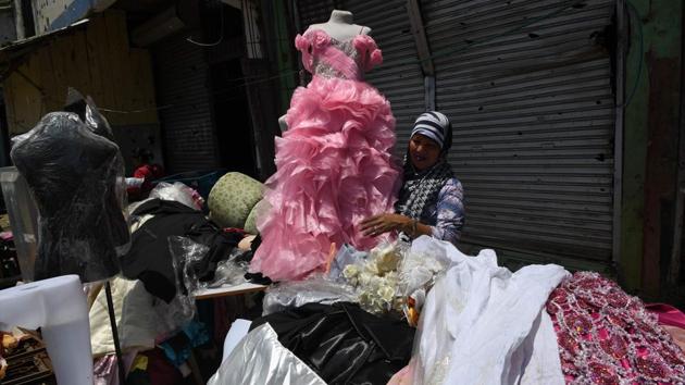 “I cried in anger, pain,” Samsida Mangcol, 44, told AFP of the moment she saw what was left of her bridal boutique, which now has “I love ISIS” spray-painted across one its walls. “I used to rent out clothes but now I have become a beggar, asking my relatives for things to eat and wear,” the mother-of-three said as she caressed a ruined wedding gown. (Ted Aljibe / AFP)