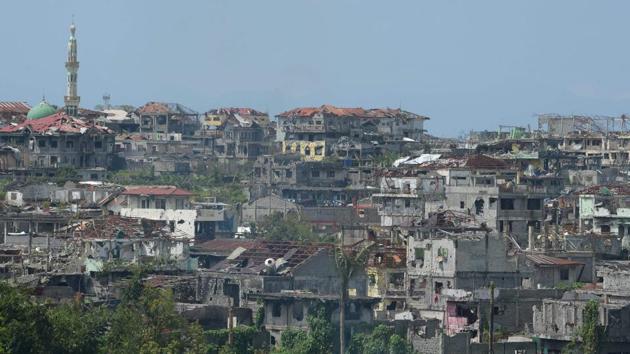 Marawi on Mindanao island, the principal Islamic city in the mainly Catholic Philippines, was besieged by hundreds of local and foreign gunmen waving black IS flags who attacked it in what authorities said was an attempt to establish a Southeast Asian base. (Ted Aljibe / AFP)