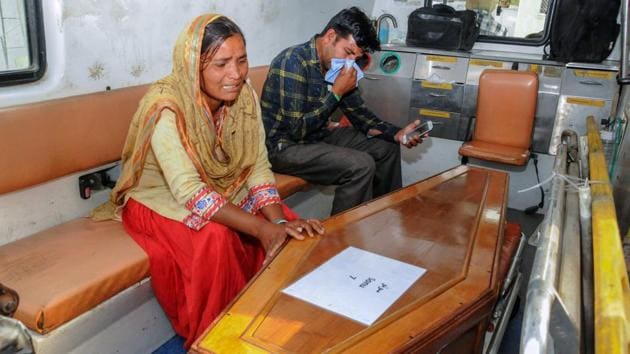 Family members mourn near a casket containing remains of one of the Indians abducted by the Islamic State group in 2014, that were found in a mass grave outside Mosul in Amritsar on Monday.(PTI Photo) Family members mourn near a casket containing remains of one of the Indians abducted by the Islamic State group in 2014, that were found in a mass grave outside Mosul in Amritsar on Monday.(PTI Photo)
