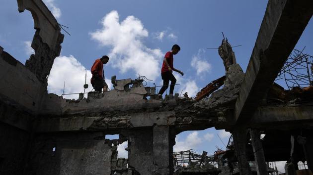 Many of the city’s 200,000 residents fled their homes in a rush for safety, including more than 10,000 people from the so-called “ground zero”. They have since been living in evacuation centres or with relatives in other towns. Months after the fighting ended, residents still visited at their own risk. (Ted Aljibe / AFP)