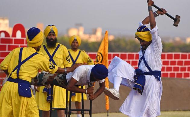 Army personnel perform Gatka, the martial arts of Punjab, during the 124th Raising Day of Southern Command Military Tattoo event at Race course in Pune on March 31. (PRATHAM GOKHALE/HT PHOTO)