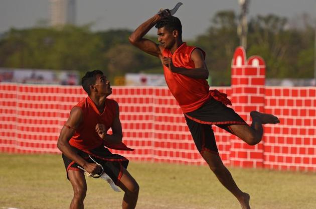 Army personnel display Kalaripayattu, a martial art form of Kerala, during the 124th Raising Day of Southern Command Military Tattoo event at Race course in Pune on March 31. (PRATHAM GOKHALE/HT PHOTO)