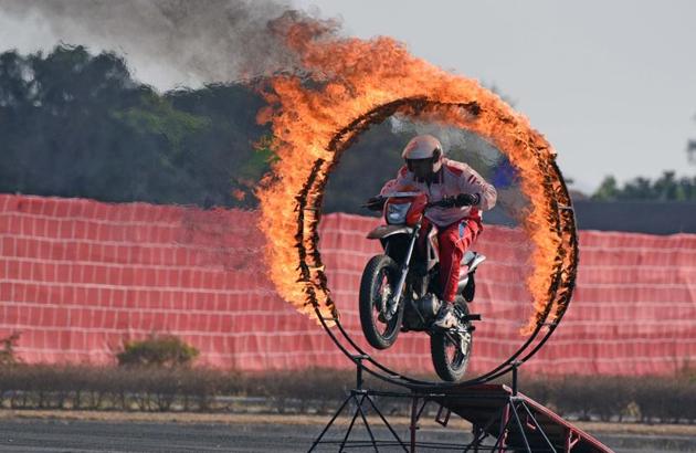 Army personnel display bike skills during the 124th Raising Day of Southern Command Military Tattoo event at Race course in Pune on March 31. (PRATHAM GOKHALE/HT PHOTO)