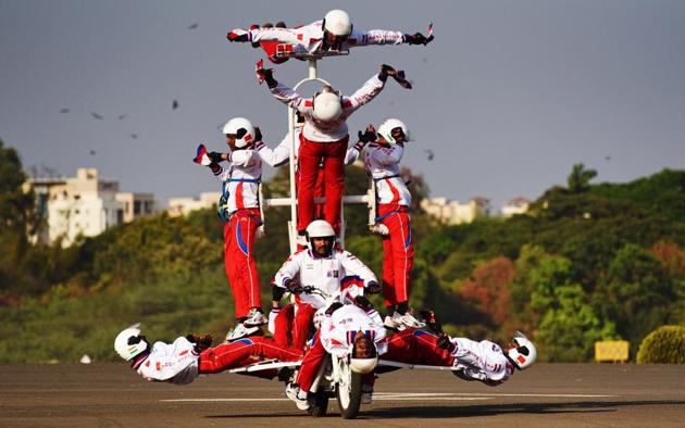 Army personnel display a motorcycle daredevil show during the 124th Raising Day of Southern Command Military Tattoo event at Race course in Pune on March 31. (PRATHAM GOKHALE/HT PHOTO)
