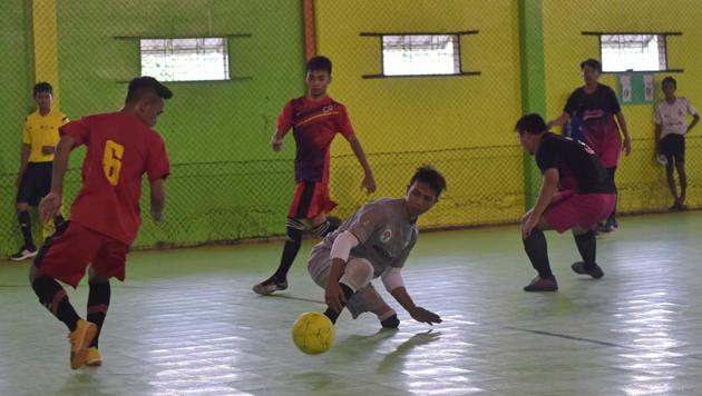 Indonesian goalkeeper Eman Sulaeman (C) in action during a futsal (five-a-side indoor football) match in Indramayu, West Java.(AFP)
