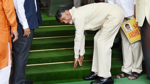 Andhra Pradesh chief minister N Chandrababu Naidu touches the stair before entering the Parliament in New Delhi on Tuesday.(Arvind Yadav/HT Photo)