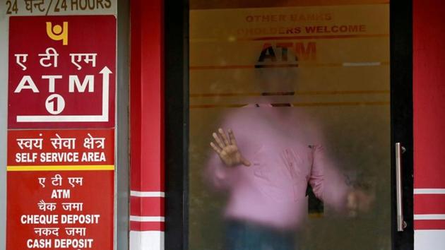 A man leaves an automated teller machine (ATM) facility of Punjab National Bank (PNB) in New Delhi on February 27, 2018.(REUTERS) A man leaves an automated teller machine (ATM) facility of Punjab National Bank (PNB) in New Delhi on February 27, 2018.(REUTERS)