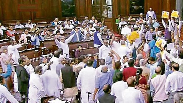 Opposition members protest in the well of the Rajya Sabha on Wednesday.(PTI File Photo) Opposition members protest in the well of the Rajya Sabha on Wednesday.(PTI File Photo)