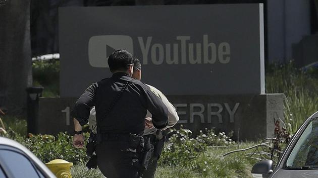 Officers run toward the YouTube headquarters in San Bruno, California, on April 3, 2018.(AP) Officers run toward the YouTube headquarters in San Bruno, California, on April 3, 2018.(AP)