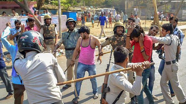 Police personnel lathi charge a protestor during 'Bharat Bandh' against the alleged 'dilution' of Scheduled Castes/Scheduled Tribes act, in Gwalior on April 2, 2018.(PTI Photo) Police personnel lathi charge a protestor during 'Bharat Bandh' against the alleged 'dilution' of Scheduled Castes/Scheduled Tribes act, in Gwalior on April 2, 2018.(PTI Photo)