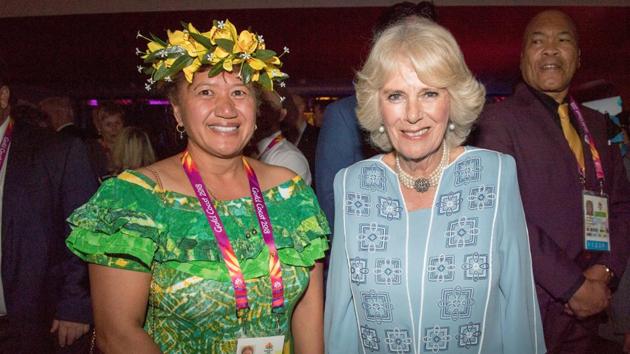 Camilla, Duchess of Cornwall, poses with Tau Estalla, a delegate from the Cook Islands, at a reception before the opening of the Commonwealth Games. (REUTERS)
