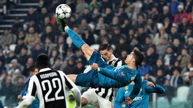 Real Madrid's Portuguese forward Cristiano Ronaldo (C) scores his overhead goal during the UEFA Champions League quarter-final first leg football match against Juventus at the Juventus Stadium in Turin on Tuesday. (AFP)