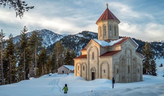 A man walking past a church in Samegrelo-Zemi Svaneti.(AFP)