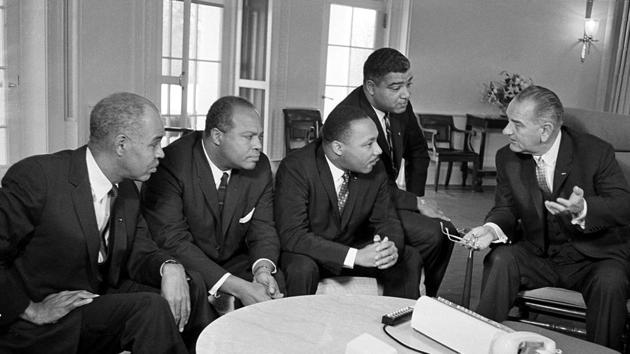 US President Lyndon B. Johnson (R), talks with Martin Luther King Jr (3rd-R) and other civil rights leaders in the White House in Washington on January 18, 1964. (AP File) US President Lyndon B. Johnson (R), talks with Martin Luther King Jr (3rd-R) and other civil rights leaders in the White House in Washington on January 18, 1964. (AP File)