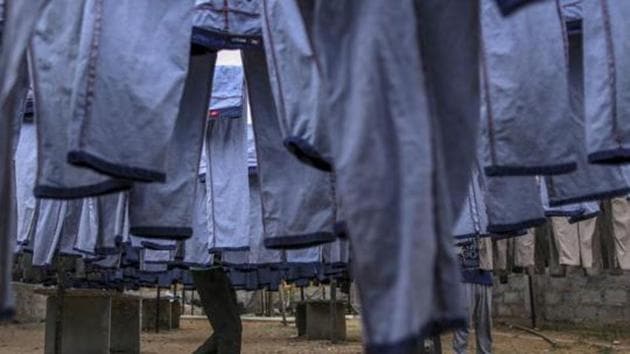 Denim jeans hang drying outside a factory at an apparel park in Karnataka.(Bloomberg File) Denim jeans hang drying outside a factory at an apparel park in Karnataka.(Bloomberg File)