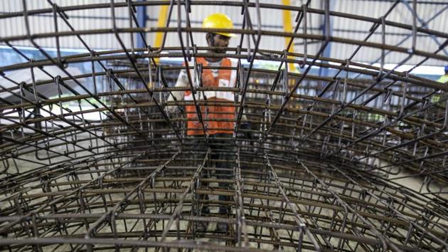 The steel reinforcing frames of precast concrete tunnel segments sit stacked at the Mumbai Metro Rail Corp. casting yard in Mumbai in August 2017.(Dhiraj Singh/Bloomberg)