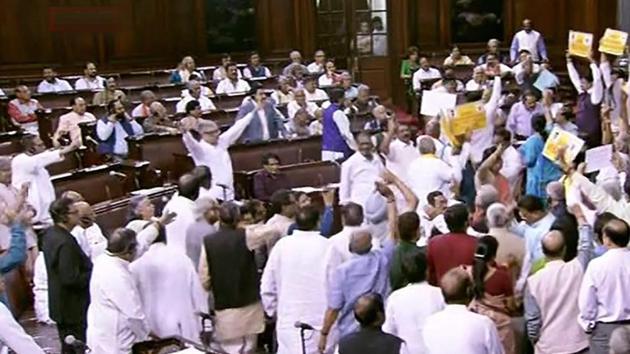 Opposition members protest in front of Rajya Sabha chairperson M Venkaiah Naidu during the ongoing budget session of Rajya Sabha, at Parliament House in New Delhi on Wednesday.(PTI Photo) Opposition members protest in front of Rajya Sabha chairperson M Venkaiah Naidu during the ongoing budget session of Rajya Sabha, at Parliament House in New Delhi on Wednesday.(PTI Photo)