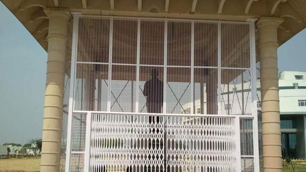 BR Ambedkar’s statue in Lucknow’s Babasaheb Bhimrao Ambedkar University is surrounded with iron grills.(HT Photo) BR Ambedkar’s statue in Lucknow’s Babasaheb Bhimrao Ambedkar University is surrounded with iron grills.(HT Photo)