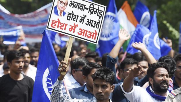 Members of the Dalit community stage a protest during 'Bharat Bandh' against Supreme Court’s judgement diluting provisions of the SC-ST atrocities Act, near Connaught Place in New Delhi.(Arvind Yadav/HT File Photo)
