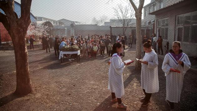 Pei, who still gives mass and takes confession, was ushered away by a heavyset man wearing a belt with a police emblem when Reuters tried to interview him. Reuters also found their invitation to attend Good Friday mass rescinded and no response from the local government spokesman of vehicles following them. (Damir Sagolj / REUTERS)
