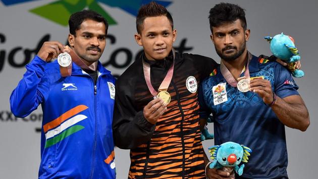 India’s first medal of the 2018 Commonwealth Games was won by P Gururaja (C) who won silver in the Men's 56kg Weightlifting final. (PTI) India’s first medal of the 2018 Commonwealth Games was won by P Gururaja (C) who won silver in the Men's 56kg Weightlifting final. (PTI)