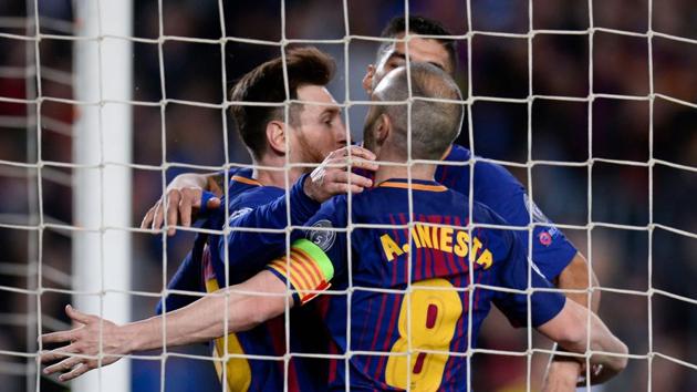 (L-R) FC Barcelona's Lionel Messi, Luis Suarez and Andres Iniesta celebrate after AS Roma scored an own goal during their UEFA Champions League quarterfinal first leg football match at the Camp Nou Stadium in Barcelona on Wednesday.(AFP) (L-R) FC Barcelona's Lionel Messi, Luis Suarez and Andres Iniesta celebrate after AS Roma scored an own goal during their UEFA Champions League quarterfinal first leg football match at the Camp Nou Stadium in Barcelona on Wednesday.(AFP)