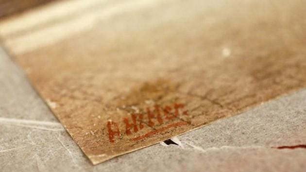 The signature of former German dictator Adolf Hitler is seen on a painting of the old registry office in Munich, at Weidler auction house in Nuremberg November 18, 2014.(REUTERS//Kai Pfaffenbach/File Photo)