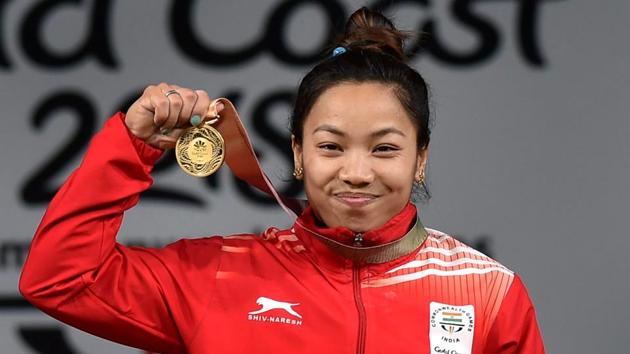 Weightlifter Mirabai Chanu secured India’s first gold medal on the first day of the Commonwealth Games after lifting a combined 196 kg (86 kg in snatch and 110 in clean and jerk) in the 48kg category. Chanu also broke three Commonwealth records en route her medal victory. (Manvender Vashist / PTI) Weightlifter Mirabai Chanu secured India’s first gold medal on the first day of the Commonwealth Games after lifting a combined 196 kg (86 kg in snatch and 110 in clean and jerk) in the 48kg category. Chanu also broke three Commonwealth records en route her medal victory. (Manvender Vashist / PTI)