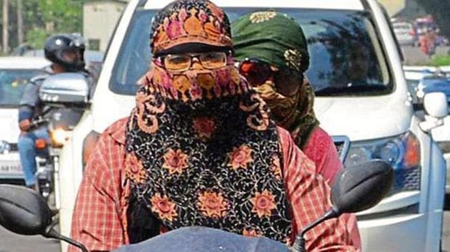 Punjab and Haryana exempt only Sikh women from wearing helmets while Chandigarh exempts all women.(HT File) Punjab and Haryana exempt only Sikh women from wearing helmets while Chandigarh exempts all women.(HT File)