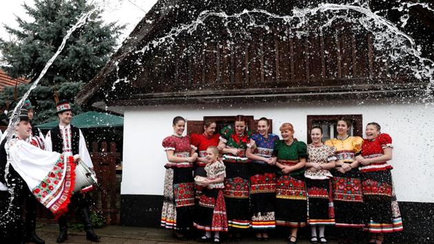 Men throw water on women as part of traditional Easter celebrations in Mezokovesd, Hungary. (Bernadett Szabo / REUTERS)