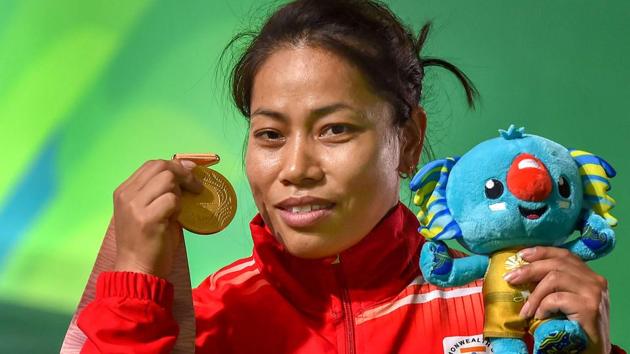 Sanjita Chanu poses with her gold medal after winning the women's 53kg weightlifting event at the 2018 Commonwealth Games in Gold Coast on Friday.(PTI)