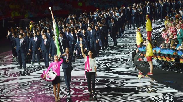 Olympic silver medallist PV Sindhu bears the Indian tricolour as she leads the Indian contingent at Carrara Stadium during the opening ceremony of Commonwealth Games 2018, in Gold Coast in Australia on Wednesday. (Manvender Vashist / PTI)