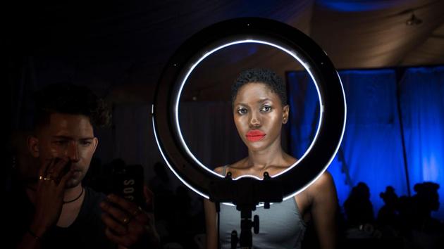 A model prepares backstage during the Accra Fashion Week in Accra, Ghana. (Cristina Aldehuela / AFP)