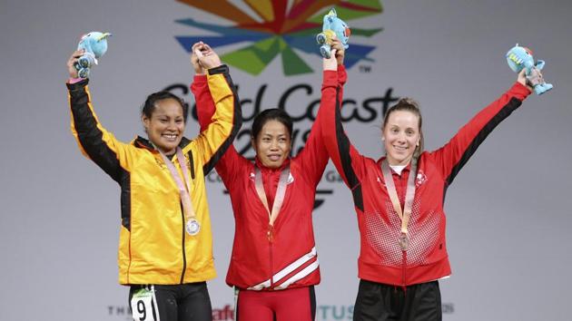 Sanjita Chanu (C), silver medallist Loa Dika Toua of Papua New Guinea (L) and bronze medallist Rachel Leblanc-Bazinet of Canada at the medals ceremony. (REUTERS) Sanjita Chanu (C), silver medallist Loa Dika Toua of Papua New Guinea (L) and bronze medallist Rachel Leblanc-Bazinet of Canada at the medals ceremony. (REUTERS)