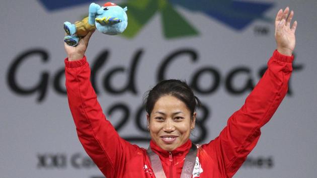 Sanjita Chanu waves as she holds her Borobi plush doll during the ceremony. (REUTERS) Sanjita Chanu waves as she holds her Borobi plush doll during the ceremony. (REUTERS)