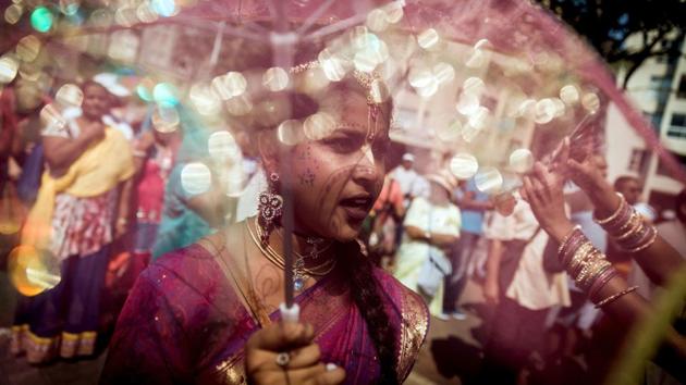 Hare Krishna devotees from all over South Africa sing and chant as they march through North Beach in Durban during the 29th annual Rathayatra or Festival of Chariots. (Rajesh Jantilal / AFP)