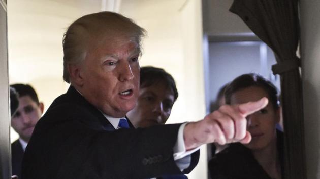 US President Donald Trump speaks to reporters on board Airforce One as he travels back to Washington on Thursday.(AFP Photo) US President Donald Trump speaks to reporters on board Airforce One as he travels back to Washington on Thursday.(AFP Photo)