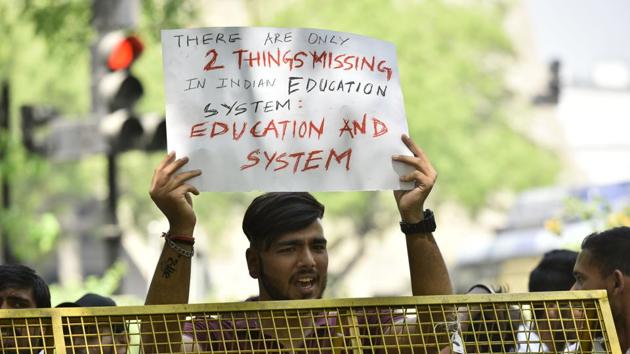 Students protest against the Central Board of Secondary Education (CBSE) for announcing the re-examination of the leaked papers near Jantar Mantar, in New Delhi, on March 29 2018.