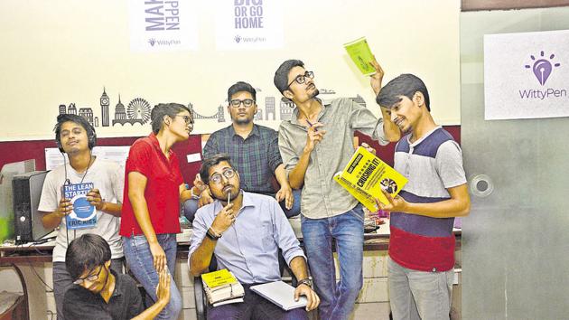 Anshul and his colleagues at Witty Pen pose for a picture on Thursday.(Shankar Narayan/HT PHOTO)